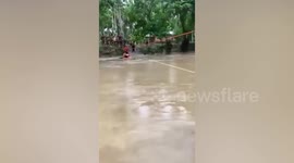 Baby rescued with zip line during Tropical Storm Jelawat in the Philippines