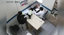 Sick puppy causes mess as vet's clothes get soiled with explosive diarrhea