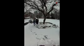 Man taking the trash cans inside slips on the frozen floor and falls hard