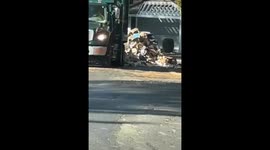 Garbage Truck Drops Trash In Driveway