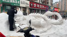 Majestic Lifelike Snow Dragon Emerging on Street Stuns Passersby in China