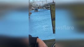 Van Navigating Dangerous Floodwaters in Amityville, NY, USA