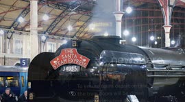 Special festive Santa steam train service delights as it leaves London's Victoria Station in a cloud of smoke