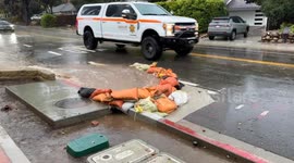 Sandbags divert rain water from residence on Olive Mill Rd., in Montecito, CA