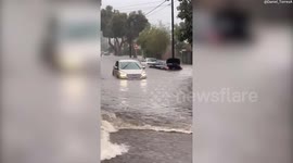 Video shows cars submerged and residents wading through floodwater in Santa Barbara
