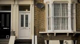 Police officers on site where a four-year-old boy has died after suffering knife injuries in London, UK