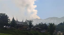 Mount Marapi spews volcanic materials during its eruption in Tanah Datar, West Sumatra, Indonesia, on December 23,2023. Largest West Sumatra Airport Reopens After Mount Marapi ash cloud grounded flights.