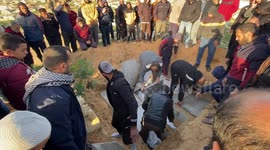 The bodies of 6 people, including women and children, who died on the Israeli attack the Dhair family home, are buried in Shabura camp