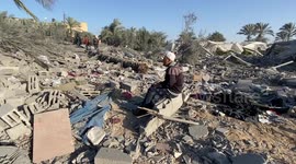Palestinian Residents inspect around the rubble of the building following an Israeli attack in Rafah, Gaza.