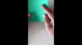 Watch how to make this DIY origami Christmas tree decoration