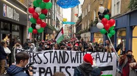 Pro-Palestine protesters call for a boycott of Puma on London’s Carnaby Street