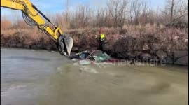 Criminal's Daring River Escape Foiled: Stolen Car Rescued by Excavator in Pueblo, CO, USA