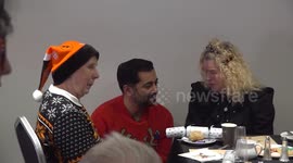 Humza Yousaf serves an early Christmas dinner to elderly residents at risk of loneliness in Dundee, UK