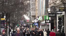 Christmas shoppers in Oxford Street get some last minute gifts on Christmas Eve in London, UK