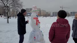 Russian locals make snowmen in park in St Petersburg
