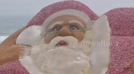 Sand artist created a beautiful crafts onion-santa at Puri beach with green Christmas message