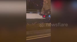 Dramatic footage shows motorist honking at driver of blazing truck