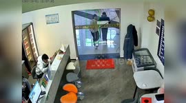 Shopper shatters sliding glass door into pieces while closing it