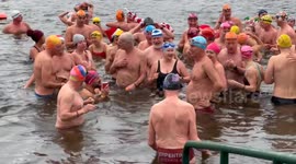 Serpentine Swimming Club's Peter Pan Cup race takes place in London's Hyde Park on Christmas Day