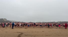 Hundreds take part in annual Christmas day swim at Bude in Cornwall