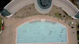 Festive swimmers brave an outdoor plunge for a Christmas Day Swim Saltdean Lido, East Sussex, Britain.UK