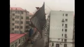 Strong wind blows roofs off buildings, destroying parked cars