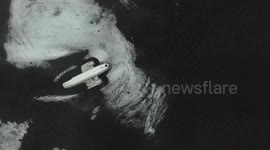 Surreal DC-3 wreck scene lost on black sand beack 1