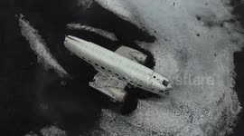 Surreal DC-3 wreck scene lost on black sand beach 2