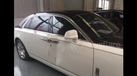 Rolls-Royce falls off car lift during repair work