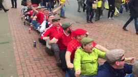 Barnsley fans do impression of rowers before Oxford cup final clash
