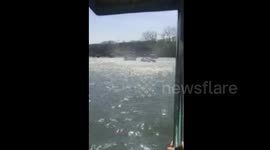 Wind vortex flips tourist boat in Chinese lake
