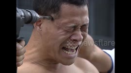 Kung-fu master takes electric drill to his temple