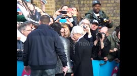 Ronnie Wood and Charlie Watts greet fans at the Saachi Gallery