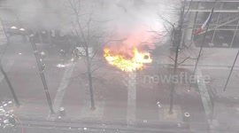 French firefighters extinguish blaze set by protesters in front of a school