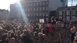 Footage of thousands of demonstrators outside Iceland's parliament building