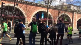 Supporters cheer on Paris Marathon runners