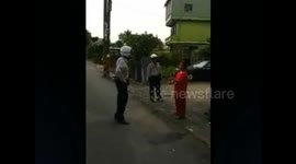 Police officer kicks knife out of woman's hand, then arrests her