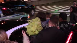 Jennifer Lopez gets mobbed by the paparazzi at LAX Airport as she arrives for a flight with her children Max and Emme