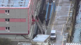 A body appears to be removed from the Bibby Stockholm in Dorset, UK