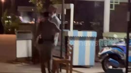 Drunk tourist performs drunken dance in front of police station in Thailand