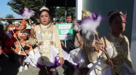 Elderly students in colourful costumes hold lively parade around Thai village