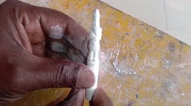 Miniature artist from eastern India makes model Santa Claus from chalk on Christmas