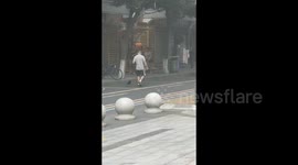 Man Walking a Bird in Chengdu, China