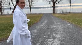 Competitive Canadian husband refuses to be out done by his wife in winter polar plunge