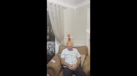 Family Plays a Game on Sleeping Grandpa