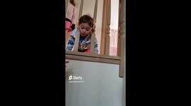 Mischievous Toddler gets head stuck in staircase bannister in Christmas day misadventure!