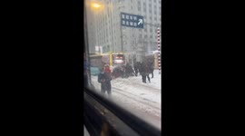 Kind passengers help push bus stuck in thick snow in China