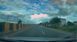 Shocking moment motorcycle rider crashes into sedan making a turn across road