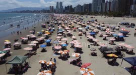 Tourists at the beach relish hot day on Christmas Evein Sao Paulo, Brazil