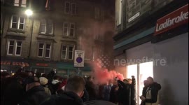 Hearts fans chanting with a set off flare before Edinburgh Derby against Hibernian FC. Easter road